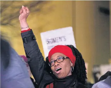  ?? AFP ?? A woman gestures during an Internatio­nal Women’s Day rally in Seattle, Washington on March 8. Black women often face a one-two punch of racism and sexism in their daily lives.