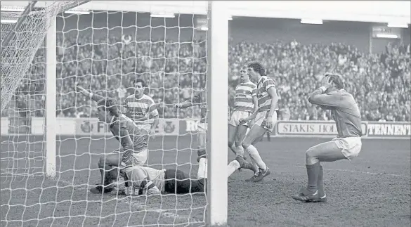  ??  ?? SINGING THE BLUES: Head in hands, Robert Fleck watches as Ally McCoist misses a goden opportunit­y and Rangers’ misery deepens.