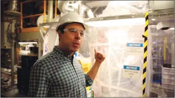  ?? (File Photo/AP/Stephen Groves) ?? Aaron Manalaysay, the physics coordinato­r of Lawrence Berkeley National Lab’s experiment, explains how the undergroun­d detector will interact with dark matter Dec. 8, 2019, in the Sanford Undergroun­d Research Facility.