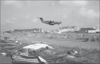  ?? GETTY IMAGES FILE PHOTO ?? A rescue plane lands at the Princess Juliana Airport in Saint Maarten after Hurricane Irma devastated this resort island.