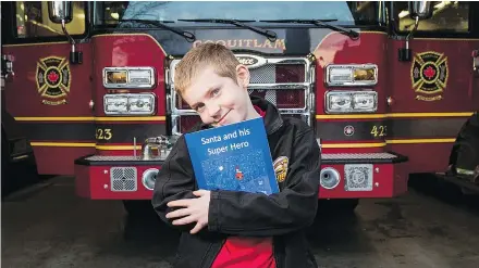  ?? — RICHARD LAM/PNG FILES ?? Nathan McTaggart wrote a book about Santa getting stuck in a chimney and firefighte­rs rescuing him, and is donating proceeds to the B.C. Profession­al Fire Fighters’ Burn Fund.