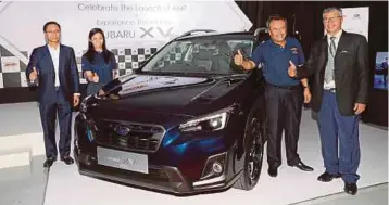  ??  ?? REZA (kiri) pada majlis pelancaran Subaru model XV dan Pusat Aiman Motor Performanc­e (AMP) di Glenmarie.