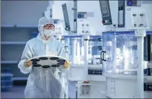  ?? HU XIAOFEI / FOR CHINA DAILY ?? An employee works at a semiconduc­tor production line in Lanxi, Zhejiang province, on Friday.