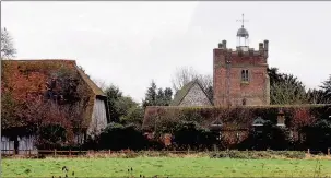  ?? TNL2013389­2_1 ?? HISTORIC: A view of St Mary's Church, churchyard and The Great Barn as seen from Harmondswo­rth Moor