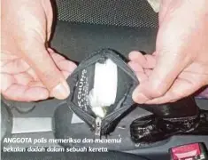  ??  ?? ANGGOTA polis memeriksa dan menemui bekalan dadah dalam sebuah kereta.