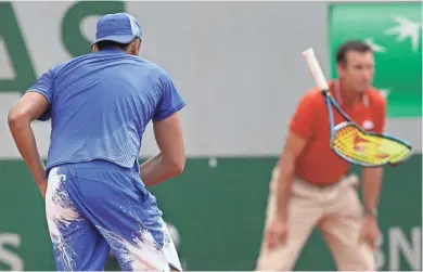  ?? ASSOCIATED PRESS ?? Australia’s Nick Kyrgios breaks his racket in his second-round match against South Africa’s Kevin Anderson at the French Open.