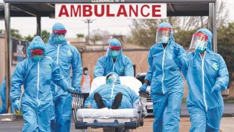  ?? Picture: AP ?? WAIT: A patient at United Memorial Medical Center in Texas, where people in cars were queued about 3km for testing.