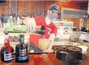  ??  ?? Corporate trainer Tori Corrado makes a top-shelf margarita Feb. 10 at Chuy’s Tex-Mex in Pembroke Pines. AMY BETH BENNETT/SUN SENTINEL