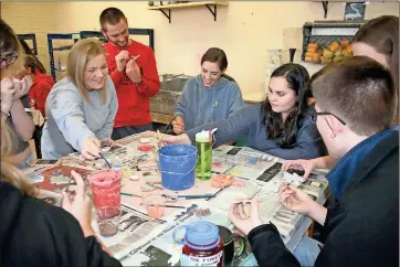  ??  ?? ABOVE: Dennis Ritter’s ceramics students work on their community art project to benefit The Ruth and Naomi Project. The Berry College students have been working on the project for about two weeks.