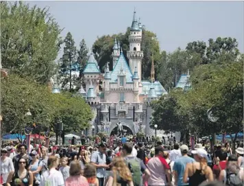  ?? Gary Coronado Los Angeles Times ?? DISNEYLAND opened in 1955. Decades later, after Anaheim agreed to invest more than $500 million in the area, the Walt Disney Co. began an expansion and in 2001 opened projects including California Adventure.