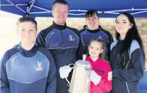  ??  ?? Guest of honour The McInnes family with the Calcutta Cup