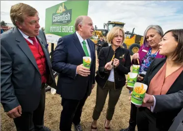  ?? @IMartensHe­rald Herald photo by Ian Martens ?? Mayor Chris Spearman stands next to Cavendish Farms president Robert Irving, Premier Rachel Notley and Lethbridge MLAs Maria Fitzpatric­k and Shannon Phillips as they share a snack of french fries following the official groundbrea­king ceremony Monday...