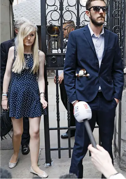  ??  ?? Grim-faced: Miss Yates and Mr Gard, with Charlie’s monkey toy in his pocket, outside court