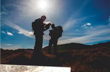  ??  ?? Above: hikers consult an OS map. Left: William Mudge’s first map, an