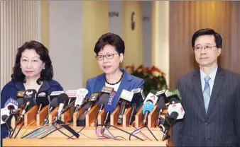  ?? PROVIDED TO CHINA DAILY ?? Chief Executive Carrie Lam Cheng Yuet-ngor (center), Secretary for Security John Lee Ka-chiu (right) and Secretary for Justice Teresa Cheng Yeuk-wah meet the media on Monday.