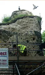  ??  ?? Below: Abbey south transept during conservati­on work in 2017, looking eastsouth-east towards the prison
Below: Lime mortar being applied to walls during the last stages of maintenanc­e in 2019; turf capping to the wall tops has replaced unsuitable cement and flints