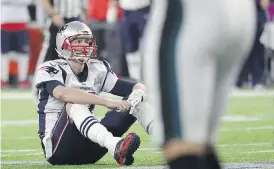  ?? ROB CARR/GETTY IMAGES ?? Tom Brady reacts after fumbling the ball in the fourth quarter.