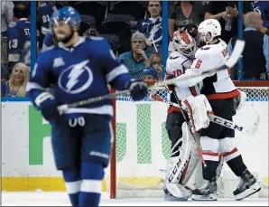  ?? AP PHOTO/CHRIS O'MEARA ?? Washington Capitals defenceman Michal Kempny and goalie Braden Holtby celebrate after the Capitals defeated the Tampa Bay Lightning 4-0 in Game 7 of the Eastern Conference finals Wednesday in Tampa.