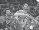  ?? DANIEL DUNN/USA TODAY SPORTS ?? Thunder forward Chet Holmgren, left, and Spurs center Victor Wembanyama battle for position during a recent game.