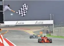  ?? THE ASSOCIATED PRESS ?? Ferrari driver Sebastian Vettel wins the Bahrain Grand Prix on Sunday in Sakhir, followed by Mercedes driver Valtteri Bottas. Lewis Hamilton, also in a Mercedes, was third.