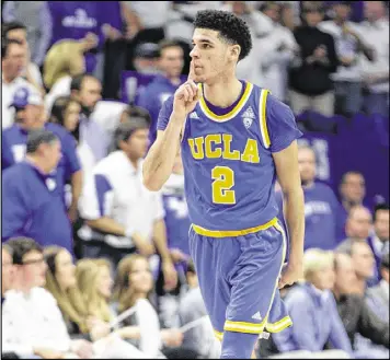  ?? MARK CORNELISON / LEXINGTON HERALD-LEADER ?? UCLA’s Lonzo Ball quiets the Rupp Arena crowd after a 3-pointer Saturday during the Bruins’ 97-92 win over the Kentucky Wildcats.