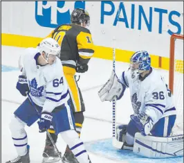  ?? Fred Vuich The Associated Press ?? A shot gets by Toronto goaltender Jack Campbell in Saturday’s clash against the host Penguins. The Leafs, another team expected to contend in the Eastern Conference, have lost five times in eight games to start the season.