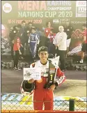  ??  ?? Kuwaiti champion Fahad Al-Khaled celebrates after winning first place in the Middle East and North Africa (MENA) KartingCha­mpionship Nations Cup 2020.