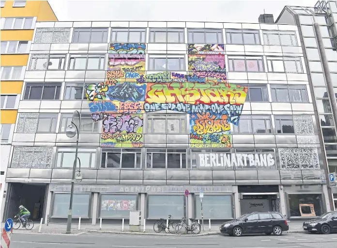  ??  ?? FLYING COLOURS: The Haus (The House), an old bank building housing an urban art project in Berlin. In arguably Europe’s urban art capital, artists have filled the five-storey space with their work.