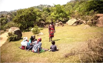  ??  ?? eSwatini parliament­ary election candidate, Alec Lushaba, explains his programme to people from a rural community on the outskirts of Mbabane in eSwatini. — AFP photo