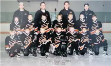  ??  ?? Stephenson, centre of the middle row, as an eight-year-old with the Sabrecat Flyers. “He never went around bragging that he was the best, never said anything to downgrade other kids,” recalls coach Keith Pettapiece.