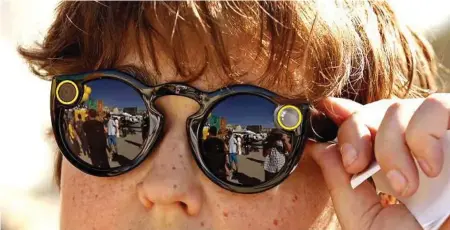  ?? Al Seib / Los Angeles Time ?? Andy Milonakis, 16, tries on Snap Spectacles on Nov. 10, the day they went on sale.