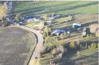  ?? CONTRIBUTE­D PHOTO BY GRUNDY COUNTY SHERIFF CLINT SHRUM ?? This aerial photo shows damage in the Pelham Valley community in Grundy County, Tennessee, from the Election Day tornado that struck the county early on Tuesday.