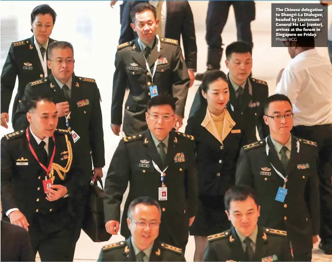  ?? Photo: VCG ?? The Chinese delegation to Shangri-La Dialogue, headed by Lieutenant­General He Lei (center), arrives at the forum in Singapore on Friday.