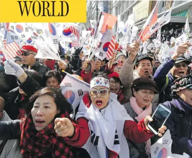  ?? AHN YOUNG-JOON / THE ASSOCIATED PRESS ?? Supporters of former South Korean president Park Geun-hye protest in Seoul on Friday after the country’s Constituti­onal Court formally removed the impeached leader from office over a corruption scandal.
