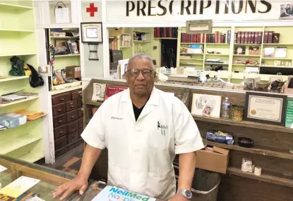  ?? MARK BROWN/SUN-TIMES ?? Howard Bolling has operated Roseland Pharmacy for 47 years. And, even though his store was looted two weeks ago, he’s aiming to keep running the business for at least three more years.