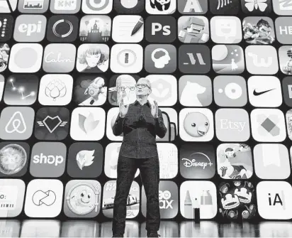  ?? Brooks Kraft / Apple Inc. / AFP via Getty Images ?? Apple CEO Tim Cook spotlights the dynamic community of App Store developers at a June conference.