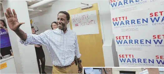  ?? STAFF PHOTOS BY NICOLAUS CZARNECKI ?? SET TO GO: Gubernator­ial candidate Setti Warren opens his campaign headquarte­rs on Albany Street in Boston yesterday. Volunteers, right, wasted no time before hitting the streets.