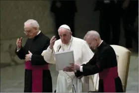  ?? PHOTOS BY ALESSANDRA TARANTINO — THE ASSOCIATED PRESS ?? Pope Francis delivers his blessing at the end of his weekly general audience in the Paul VI Hall, at the Vatican, Wednesday.