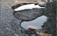  ?? ?? Councillor­s queried the quality of repairs to potholes.