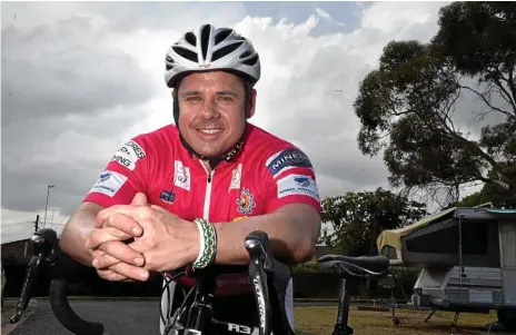  ?? Photo: Bev Lacey ?? WELL EARNED REST: 1000 K’s 4 Kids rider Andy Olrich takes a rest after riding “up the hill” to Toowoomba from Esk. Mr Orich is on his first distance ride and has raised $15,000 for Camp Quality.