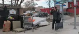  ?? JACK LAKEY ?? A pile of garbage that includes mattresses and renovation trash has gathered outside the gates of the Marigold Gardens townhomes for at least two months.