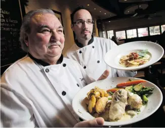  ?? PHOTOS: WAYNE CUDDINGTON/OTTAWA CITIZEN ?? Chef and owner Angelo Perseo, at right, with chef Domenic Bevilacqua, of Babbo’s Cucina Restaurant in Manotick prepare a number of dishes including Squash Agnolotti, right, and Vitello Babbo.