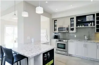  ?? PHOTOS: CAMPANALE HOMES ?? The Porter is a three-bedroom unit with custom cabinetry and standard stainless-steel appliances.