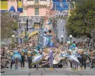  ?? Allen J. Schaben / Los Angeles Times 2020 ?? A parade at Disneyland in February 2020. California’s amusement parks could reopen as soon as April 1.