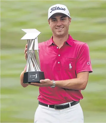  ?? EPA ?? Justin Thomas poses with the trophy after winning the 2016 CIMB Classic in Kuala Lumpur.