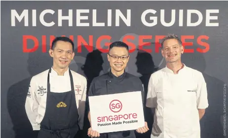  ??  ?? Chef Chayawee Sutcharitc­han, chef Malcolm Lee and chef Henrik Yde-Andersen in collaborat­ion for a Michelin Guide Dining Series dinner at Sra Bua by Kiin Kiin, Siam Kempinski.
