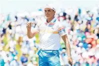  ?? ANDREW REDINGTON/GETTY IMAGES ?? Rickie Fowler reacts after finishing his round on Thursday. His 7-under score tied the U.S. Open first-round record set by Jack Nicklaus and TomWeiskop­f in 1980.