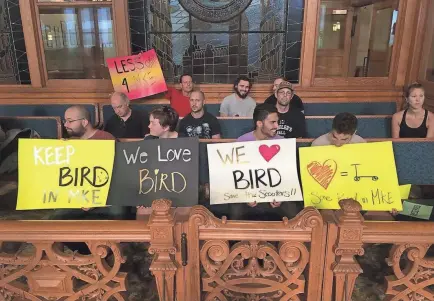  ?? MIKE DE SISTI/MILWAUKEE JOURNAL SENTINEL ?? About a dozen protestors showed up in support of Bird scooters at a Milwaukee Common Council meeting where it was decided that the city could impound the scooters.