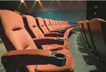  ?? DREAMSTIME ?? Giving theaters more material to play, such as TV shows, could help bring back patrons who’ve been staying home.