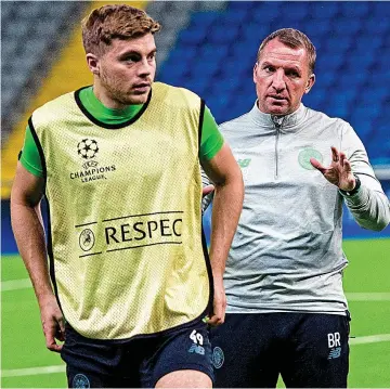  ??  ?? In charge: Celtic boss Brendan Rogers with James Forrest (left)